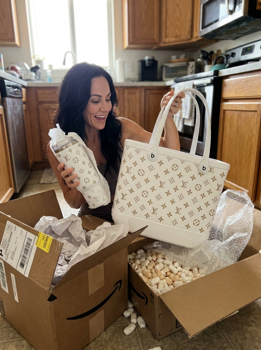 Cream tote and matching 40oz tumbler unboxed on a kitchen floor