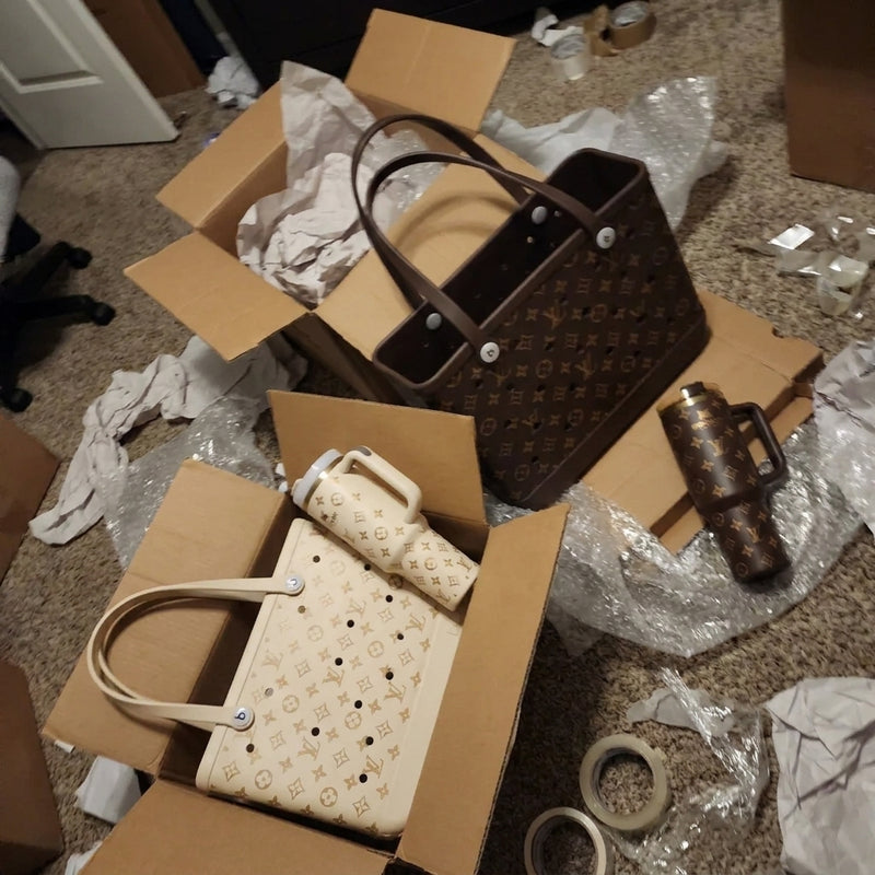 Cream set in a box and brown set laid out on the floor